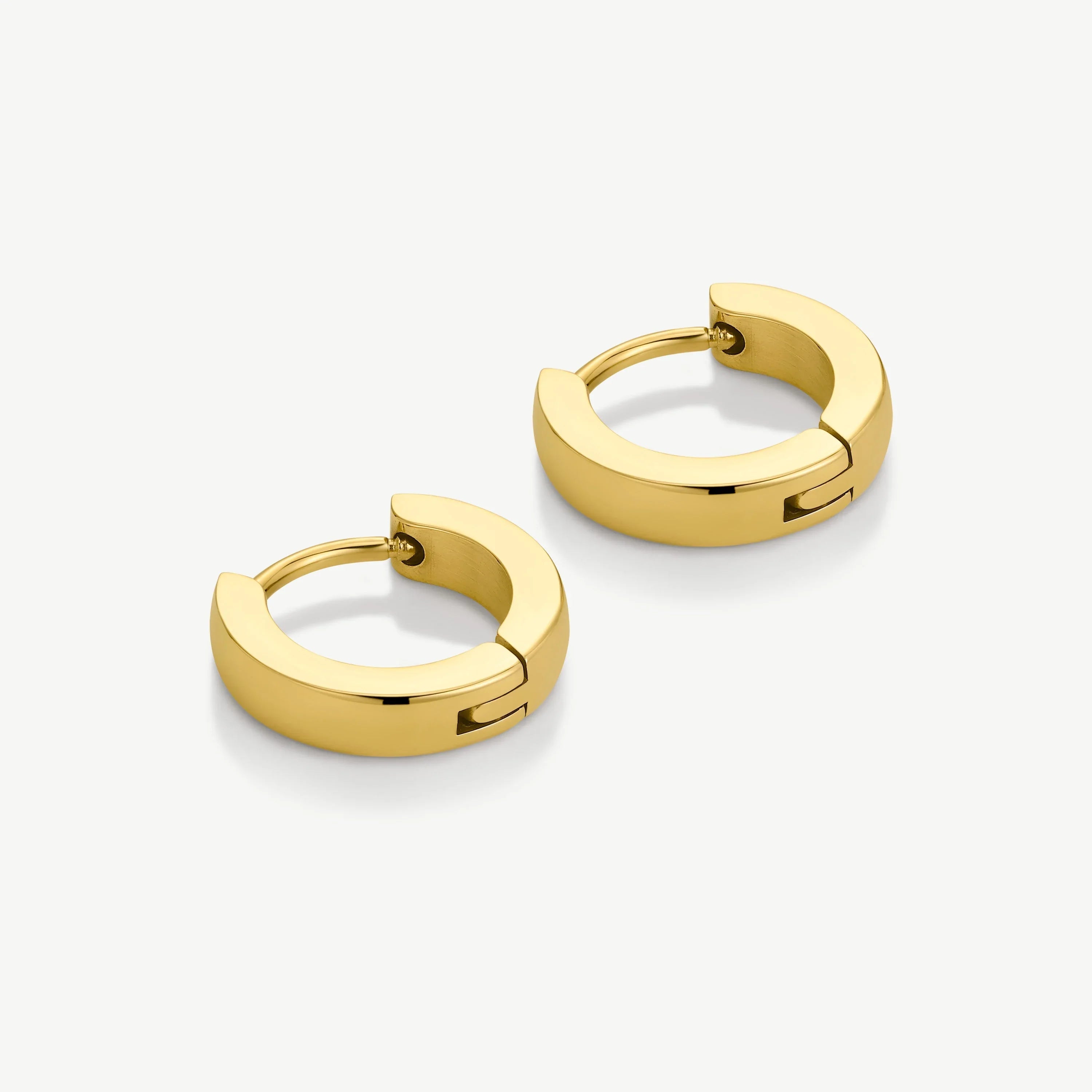 Pair of polished gold hoop earrings with a hinged clasp on white background